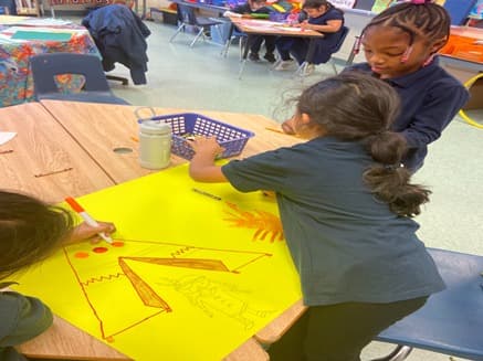 Student drawing a teepee
